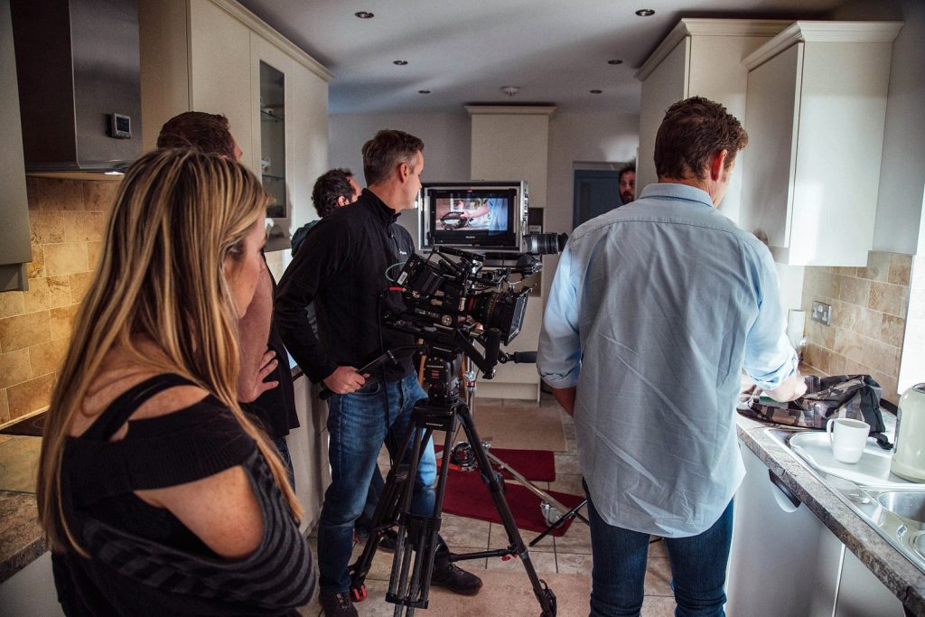 A film crew shooting a TV advert in a kitchen