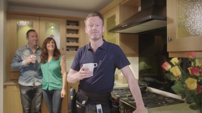 GKC Interiors TV advert: fitter with a happy couple in their new kitchen