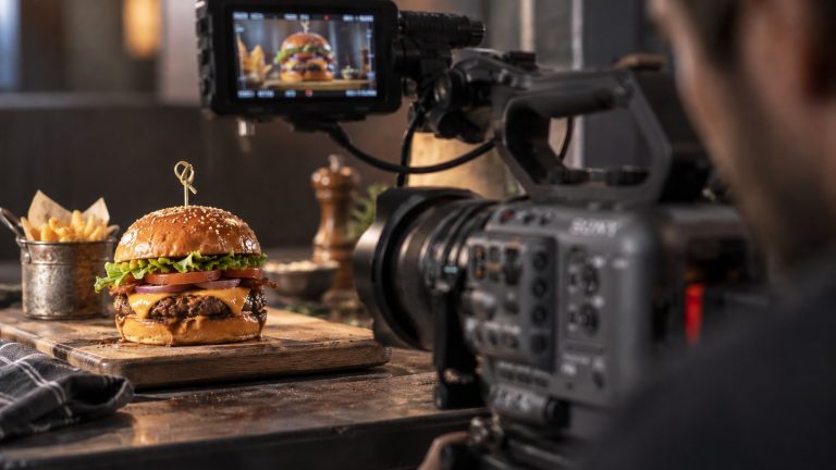 A burger being filmed for a TV advert on a studio set