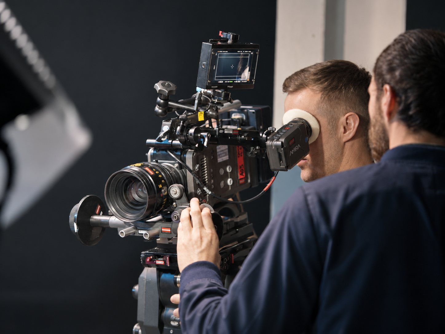 A camera operator and focus puller behind a cinema camera on one of our TV ad shoots